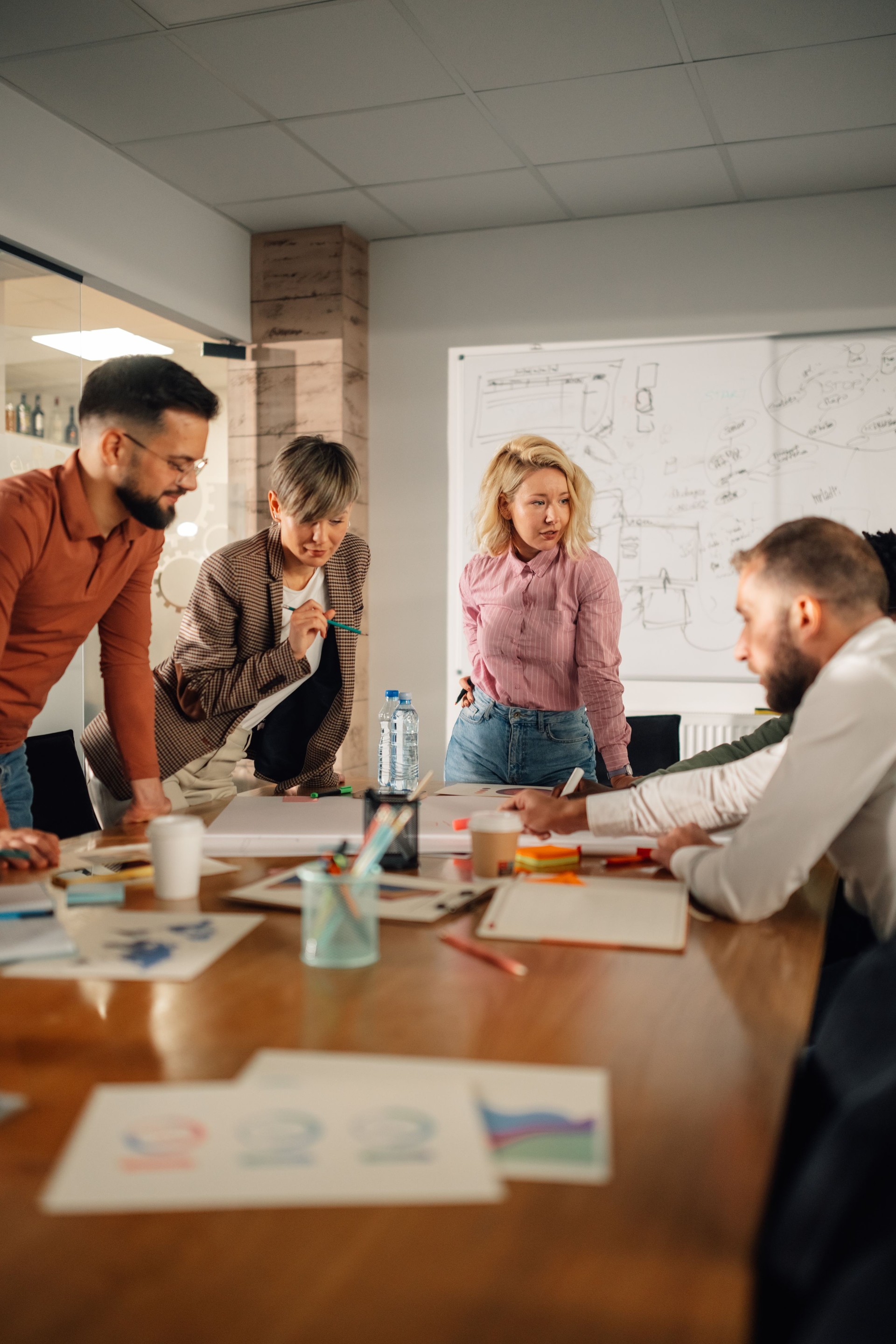 Marketing professionals collaborating on project in modern office
